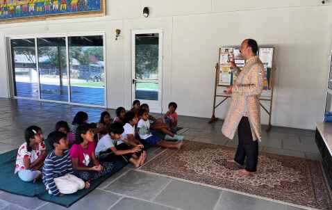A heritage and dharma talk with students seated together