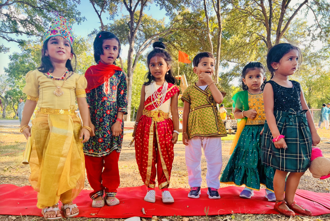 Little learners dressed for a Ram Navami procession outdoors