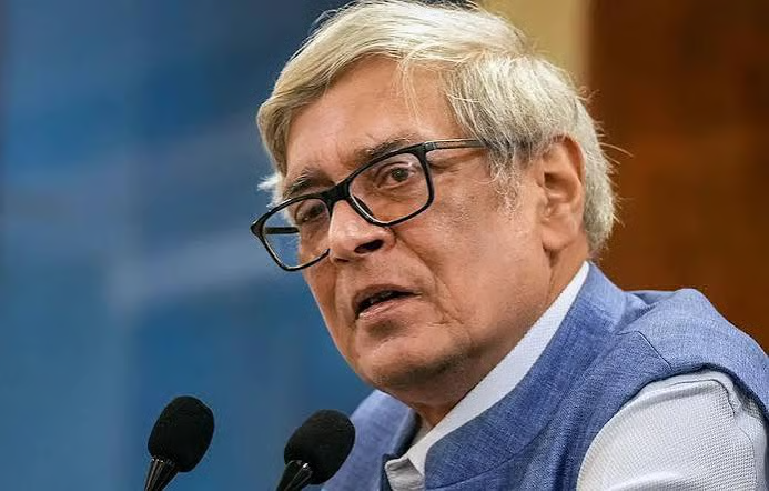 Portrait of Dr. Bibek Debroy speaking at a podium